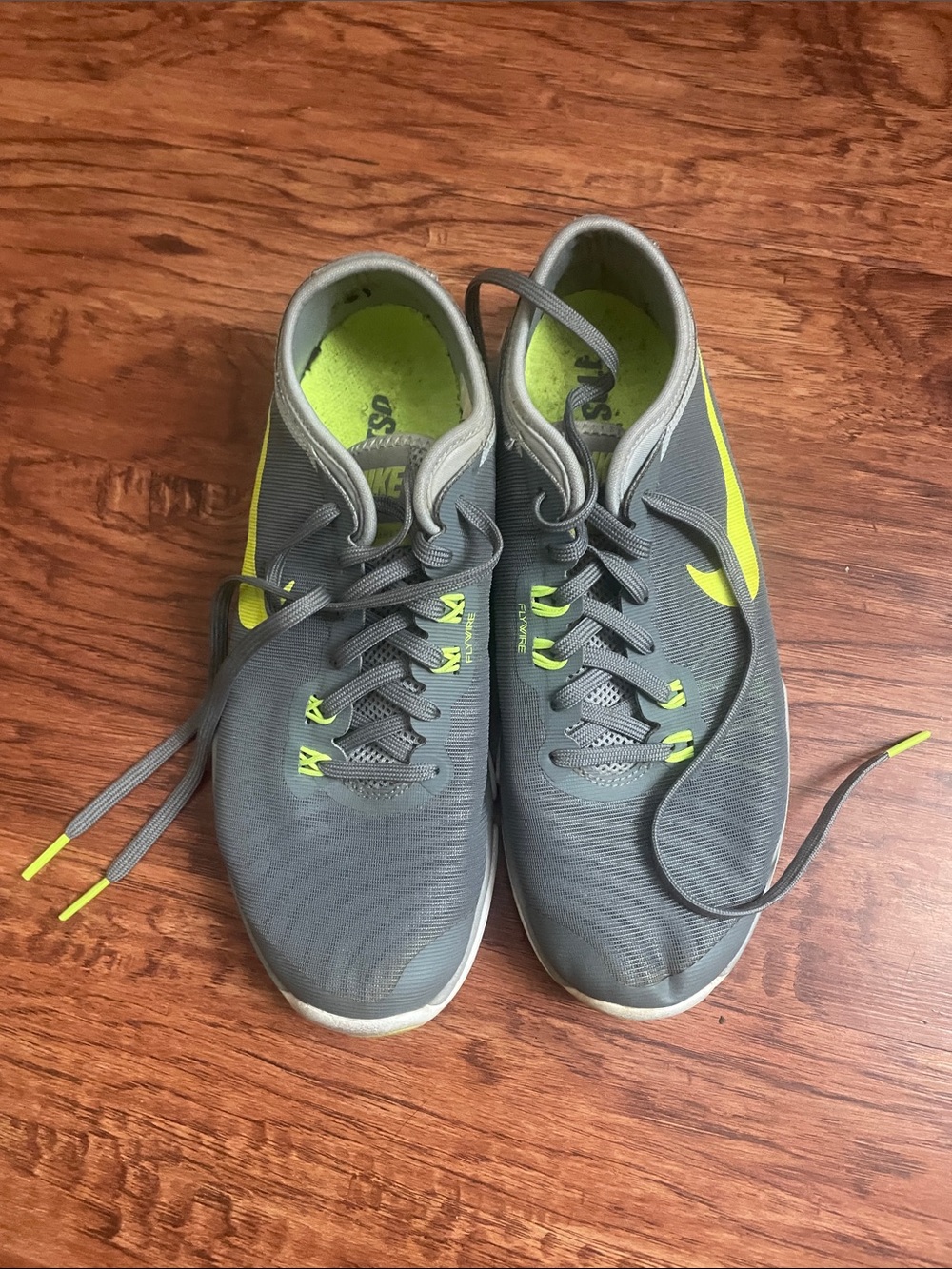Nike women’s Gray & Neon Yellow Training Sneakers